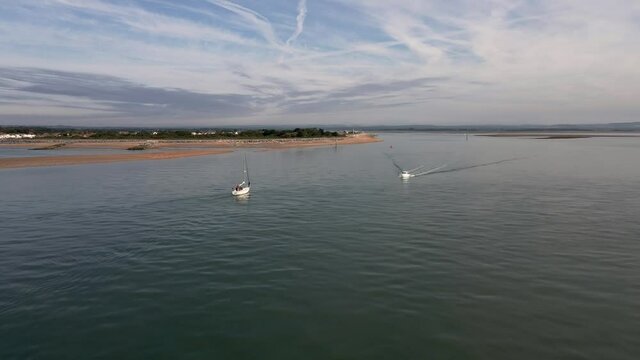 Aerial view of small vessels yachts sail in front of Hayling Beach off the coast of Southsea on a sunny morning. Bracklesham Bay. 