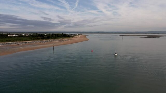 Aerial view of small vessels yachts sail in front of Hayling Beach off the coast of Southsea on a sunny morning. Bracklesham Bay. 