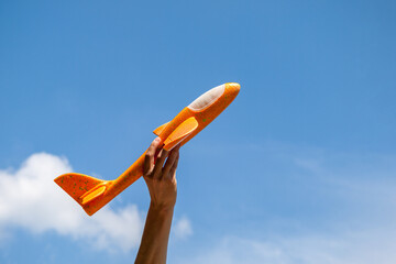 An airplane on a background of clear blue sky, a symbol of ascent and growth, success, upward...