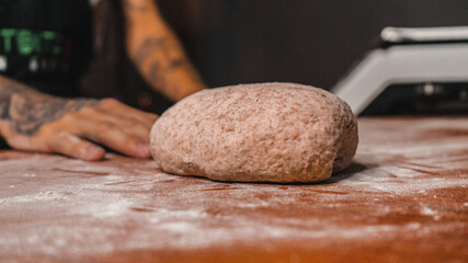 Person preparing bread.