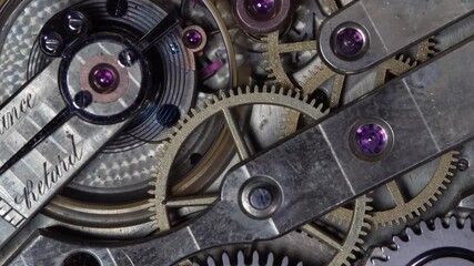 The work of the mechanism of an old pocket gold watch - Powered by Adobe