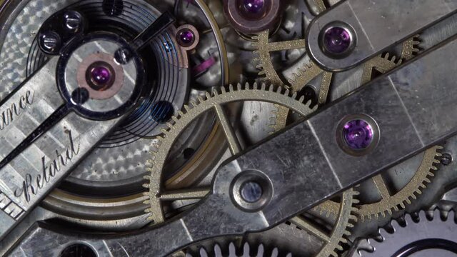 The work of the mechanism of an old pocket gold watch
