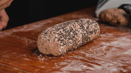 Person preparing bread.