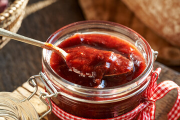 Homemade plum jam on a spoon