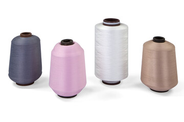 Colored yarn cones on a white background