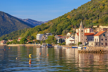 Fototapeta na wymiar Sunny autumn day, beautiful Mediterranean landscape. Montenegro, Adriatic Sea. View of Bay of Kotor and Donja Lastva village ( Tivat )