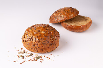 buns with sunflower seeds on a white background