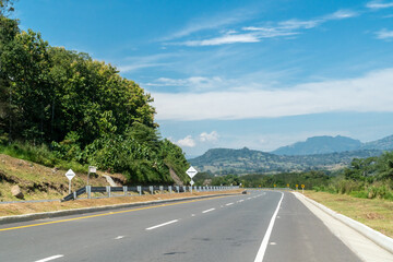 Fototapeta na wymiar Landscape with blue sky in via del pacific. Colombia.