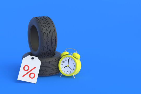 Tyres near alarm clock and label with percent symbol. Special offer. Hot discounts for wheels. Sale of car parts. Promotion, reduction of prices for tire fitting. Copy space. 3d render