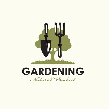 gardening emblem with trowel spade, garden fork and green tree