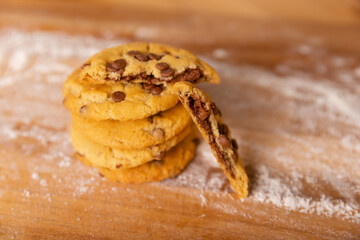 Home made giant cookies on wooden table with pieces of star anise and cinnamon