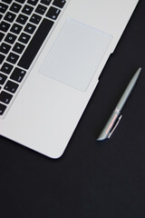 person typing on the keyboard. girl typing on the computer.office. notepad and computer. office worker. laptop on table