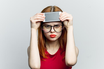 pretty woman in glasses with phone in hands communication technology