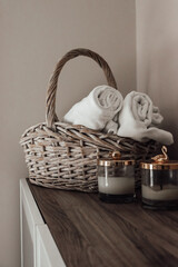 towels in a basket. basket and spa candles.