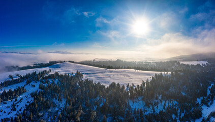 Obraz premium Picturesque winter panorama of mountain hills
