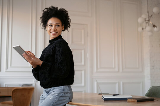 Student online training. A woman workplace in the office surfing the internet.   A freelance blogger maintains an account on a social network. The designer works on a tablet on the website.