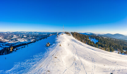Magical winter panorama of beautiful snowy slopes