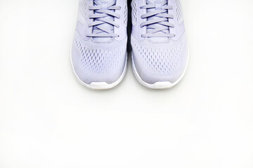 New unbranded running shoes, sneakers or trainers on white, top view