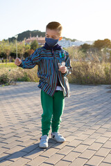 Boy playing with firecrackers known as Bombetas in Valencian fallas festivals to conmemorate Saint Joseph day on 19th March
