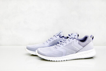 Sports shoes isolated on a white background. Blue sneakers. Side view.