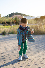 Boy launching firecrackers known as Bombetas in Valencian fallas festivals