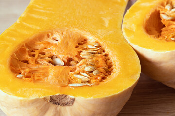 orange pumpkin with seeds cut in half close-up