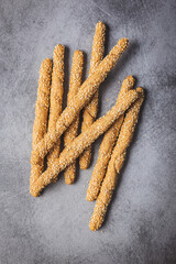 Breadsticks grissini. Bread sticks with sesame seeds.