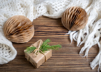 Packed Christmas gift box with natural Christmas decor, balloons and a Christmas tree. Zero waste.