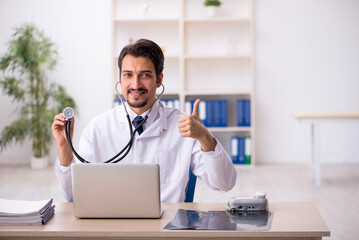 Young male doctor working in the clinic