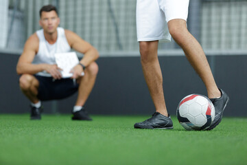 group of young men playing football on court