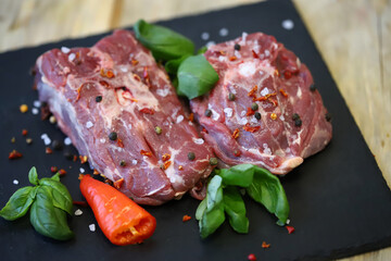 Fresh lamb meat with spices. Raw farm lamb.