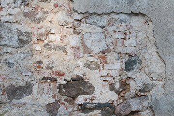 
Brick and plaster wall dirty and gray