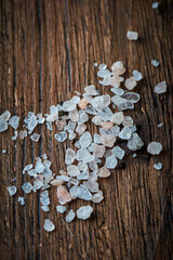 Pink himalayan salt on wooden backround
