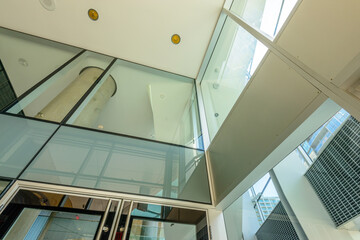 Obraz premium Abstract fragment of the architecture of modern lobby, hallway of the luxury hotel, shopping mall, business center in Vancouver, Canada. Interior design.