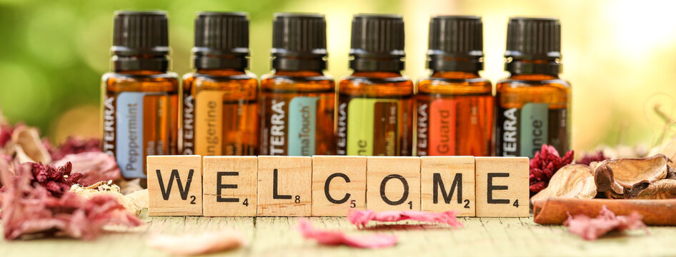 Mologa, Victoria Australia - 30 August 2021 : Essential oil image featuring Doterra oils and Welcome in wooden letters