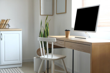 Interior of light stylish room with workplace