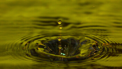 4 water droplets going to the abyss - stock photo