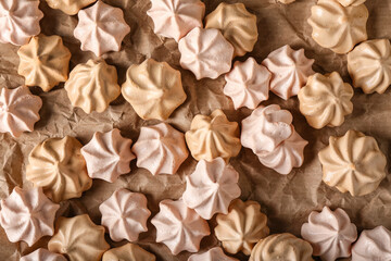 Parchment with tasty meringues, top view