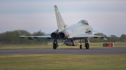 Typhoon taxiing to runway at RAF Coningsby  - stock photo.jpg - obrazy, fototapety, plakaty
