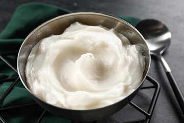 Bowl of lard spread on black background