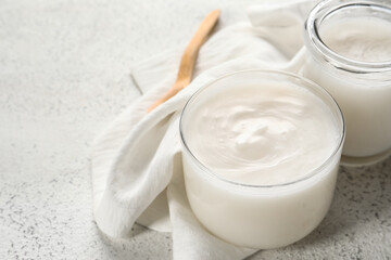 Jars of lard spread on white background