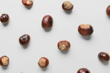 Many chestnuts on white background, closeup