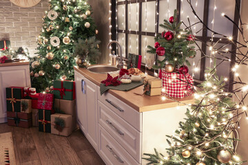 Counters with Christmas decor, food and kitchenware in modern kitchen