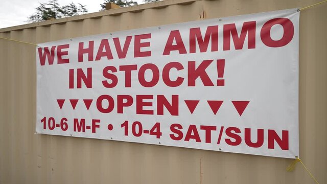 Berkeley Springs, WV, USA - 10 15 2021: Sign on rural road advertising ammo in stock.