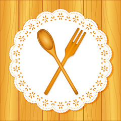 Wooden kitchen tools, spoon and fork, lace doily place mat, oak wood table background - obrazy, fototapety, plakaty