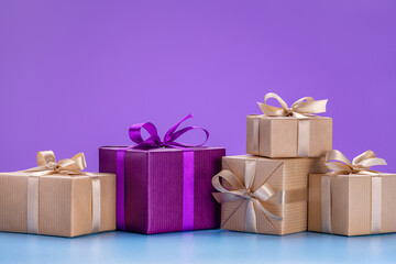 Obraz premium Concept for Christmas, New Year cards, congratulations. Gifts in holiday boxes with ribbons and bows.