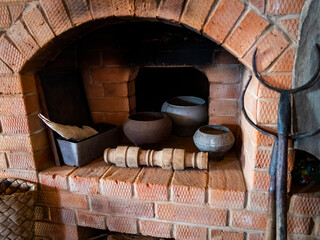 Russian traditional oven with kitchen utensils of the 19th century