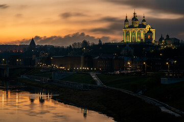 Fototapeta na wymiar View of the embankment of the Dnieper River in Smolensk, the Assumption Cathedral and the wall of the Smolensk Fortress in the night illumination, Smolensk, Russia