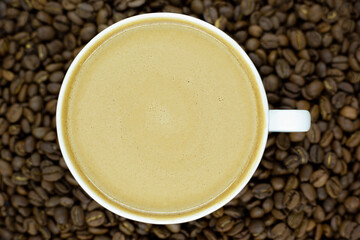 a cup of coffee and coffee beans