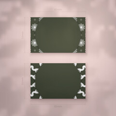 A dark green business card with vintage white ornaments for your personality.